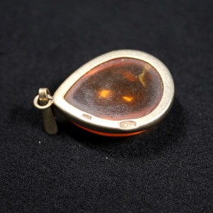 Silver pendant with amber